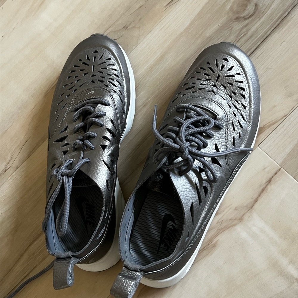 Nike Metallic Gray Sneakers with Cutout Pattern